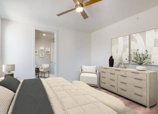 a bedroom with a large bed and a ceiling fan