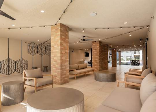 a living room with couches and chairs and a table