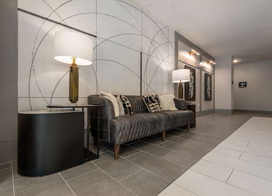 a living room with a couch and two lamps