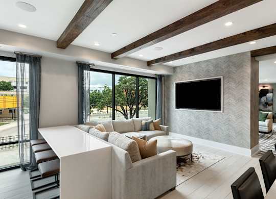 a living room filled with furniture and a large flat screen tv