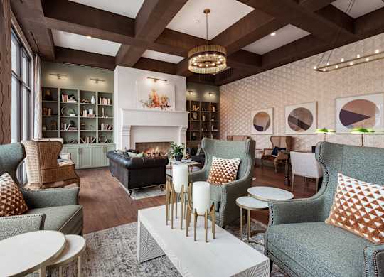 a living room filled with furniture and a fire place