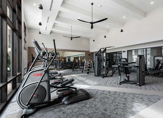a gym with treadmills and other exercise equipment