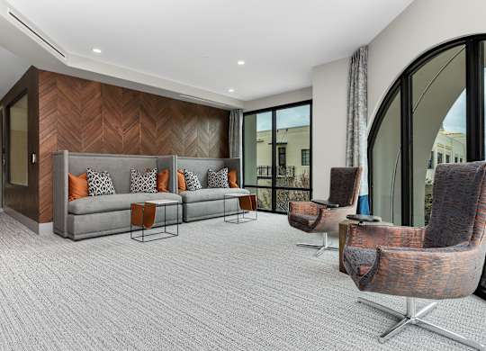 a living room with a couch and chairs