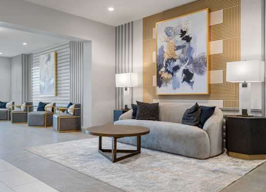 a living room filled with furniture and a large window
