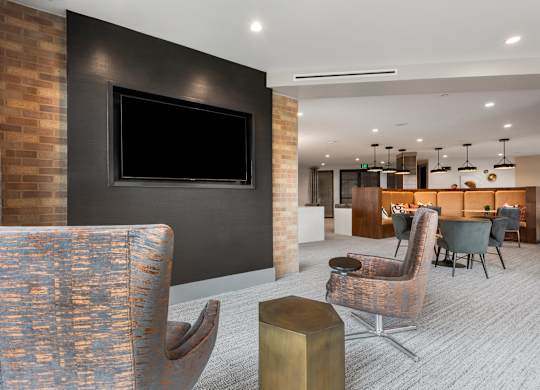 a living room filled with furniture and a flat screen tv