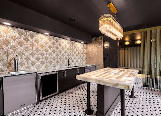 a kitchen with a marble counter top and a glass door