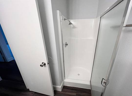 a bathroom with a shower and a sliding glass door at Northchase, Austin, TX, 78753