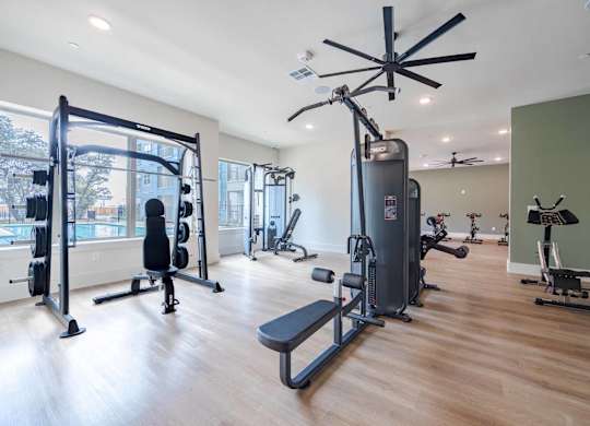 Fitness center with strength training equipment at Emilia Apartments, Boerne