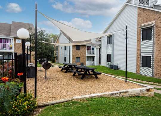 our apartments are equipped with a picnic table and a grill at Northchase, Austin