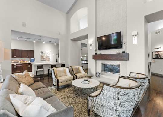 Community clubhouse with fireplace and seating at Melia Medical Center Apartments, Houston, TX