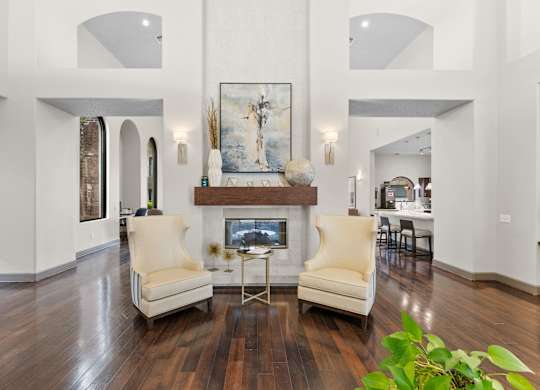 Elegant living room with fireplace and vaulted ceilings at Melia Medical Center Apartments, Texas