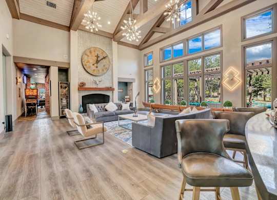 A large room with a fireplace and a large clock on the wall.