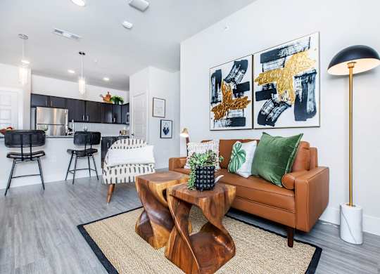 Open concept living and dining area with modern furnishings at Sienna at Westover Hills Apartments, San Antonio, Texas