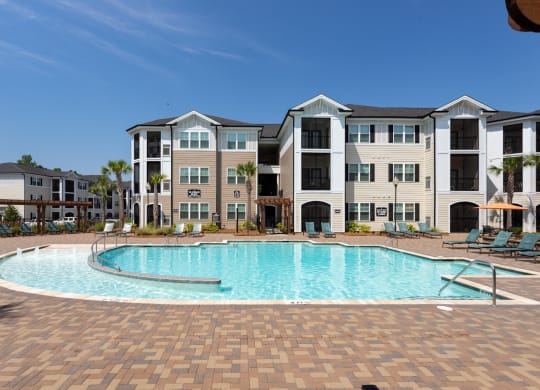 Relaxing Area by the Pool at Abberly Crossing Apartment Homes by HHHunt, Ladson