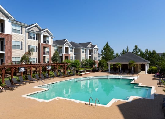 Swimming Pool With Relaxing Sundecks at Abberly Village Apartment Homes by HHHunt, West Columbia