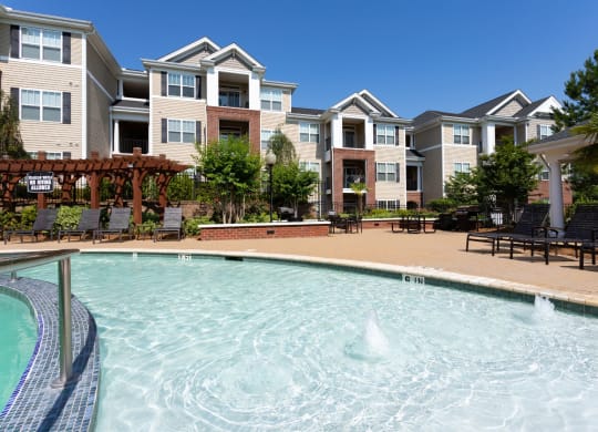 Swimming Pool With Sparkling Water at Abberly Village Apartment Homes by HHHunt, South Carolina