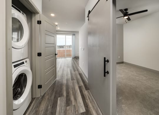 an open laundry room with a washer and dryerat Abberly Foundry Apartment Homes, Nashville, TN, 37206