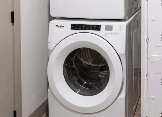a washer and dryer sit next to each other in a laundry room at Abberly Foundry Apartment Homes, Nashville, 37203