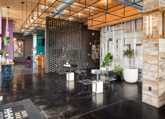 a room with black flooring and wood ceilings  at Abberly Noda Vista Apartment Homes, Charlotte, North Carolina