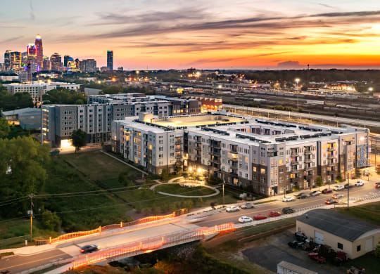 an aerial view of an apartment complex with the minneapolis skyline in the background  at Abberly Noda Vista Apartment Homes, Charlotte, NC