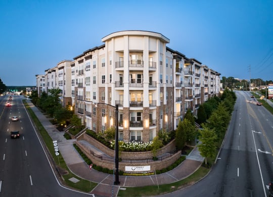 an aerial view of a large apartment building at dusk  at Abberly Onyx Apartment Homes, Decatur, 30033