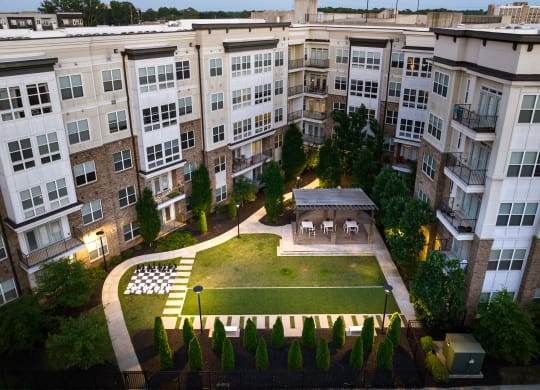 an aerial view of a building with a grassy area in front of it  at Abberly Onyx Apartment Homes, Decatur, GA