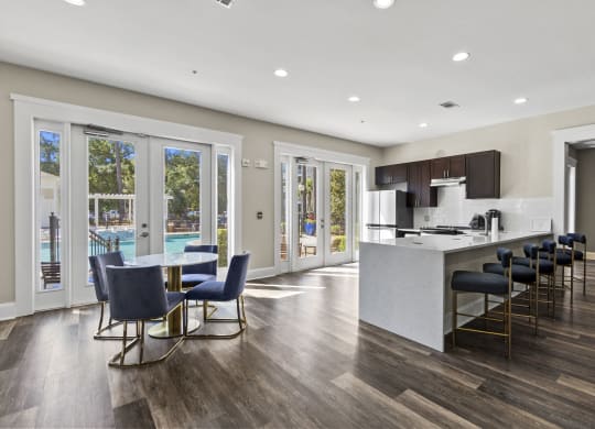 Clubhouse kitchen with bar and eating area at West Ashley Apartment Homes, South Carolina,  29414