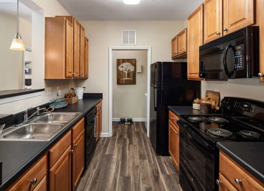 Black Kitchen Appliances at Abberly Woods Apartment Homes, North Carolina 28216