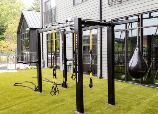 a home gym with a swing set on the lawn  at Abberly Riverwalk Apartment Homes, Nashville, 37228