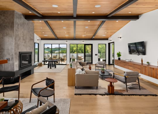 a living room filled with furniture and a large fireplace at Abberly Riverwalk Apartment Homes, Nashville, TN, 37228