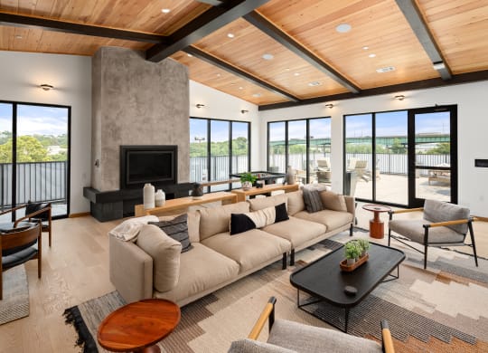 a living room with a large couch and a fireplace at Abberly Riverwalk Apartment Homes, Nashville, Tennessee