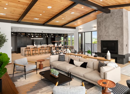 a living room filled with furniture and a large fireplace at Abberly Riverwalk Apartment Homes, Tennessee, 37228