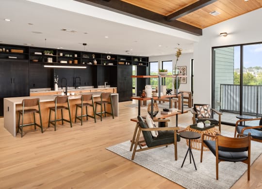 a living room filled with furniture and a large window  at Abberly Riverwalk Apartment Homes, Nashville, Tennessee