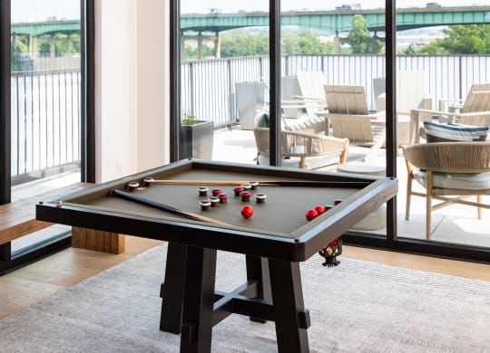 a pool table in the clubhouse  at Abberly Riverwalk Apartment Homes, Nashville, 37228