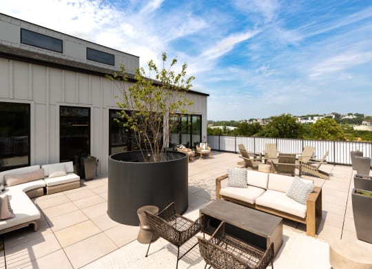 a patio with couches and chairs on a roof at Abberly Riverwalk Apartment Homes, Nashville, Tennessee