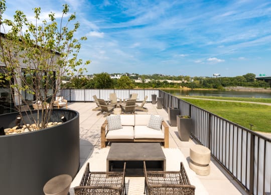 a roof deck with couches chairs and a fire pit at Abberly Riverwalk Apartment Homes, Tennessee, 37228