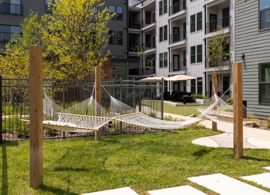 a hammock in the courtyard of an apartment building at Abberly Riverwalk Apartment Homes, Nashville, Tennessee