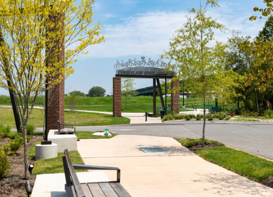 a park with a bench and trees  at Abberly Riverwalk Apartment Homes, Nashville, TN