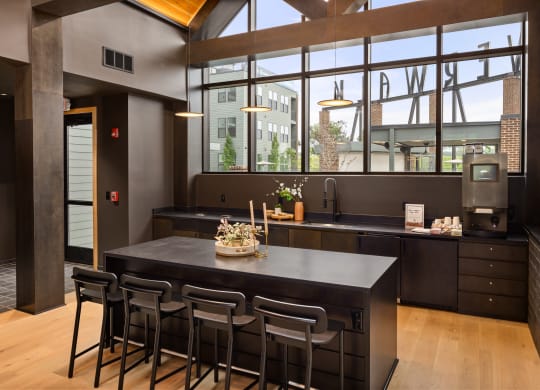 a kitchen with a large island and a large window at Abberly Riverwalk Apartment Homes, Nashville, TN, 37228