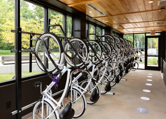 a row of bikes on a bike rack in front of a building at Abberly Riverwalk Apartment Homes, Nashville, TN, 37228