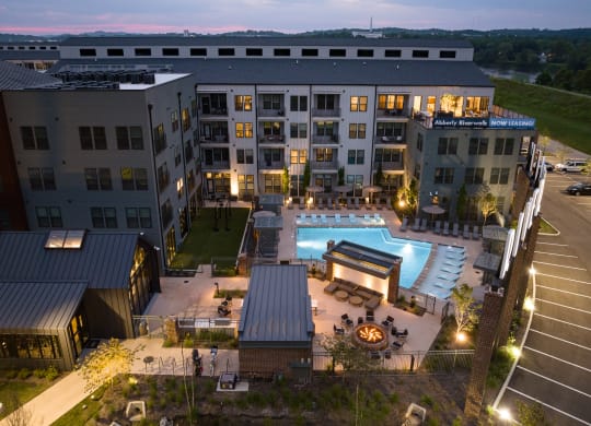 an aerial view of a large building with a pool in the middle at Abberly Riverwalk Apartment Homes, Nashville, TN
