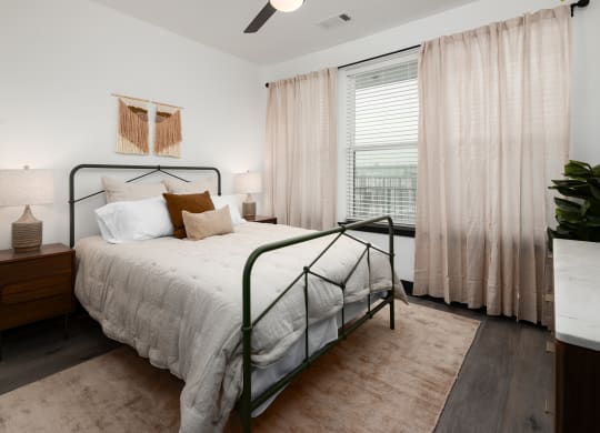a bedroom with a bed and a window  at Abberly Riverwalk Apartment Homes, Nashville, 37228