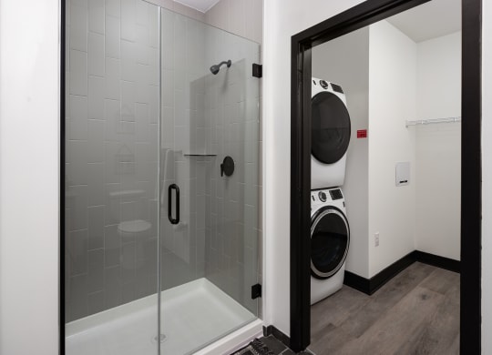 a laundry room with a washer and dryer  at Abberly Riverwalk Apartment Homes, Nashville, TN