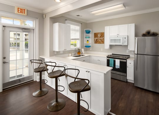 Resident clubhouse kitchen with bar  at Abberly Grove Apartment Homes, Raleigh, NC