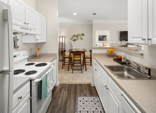Kitchen and dining area at Abberly Grove Apartment Homes, North Carolina
