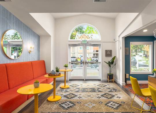 A brightly colored cafe with a view of the street outside the window.