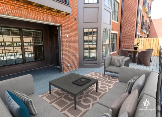 a patio with couches and a coffee table
