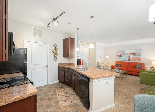 an open kitchen and living room with a counter top