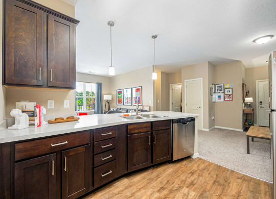a kitchen with wooden cabinets and a white counter top