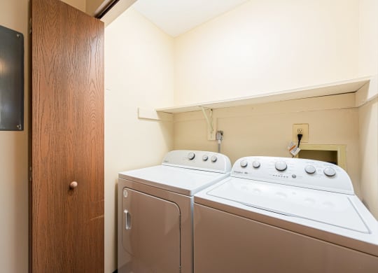 a washer and dryer in a laundry room with a door